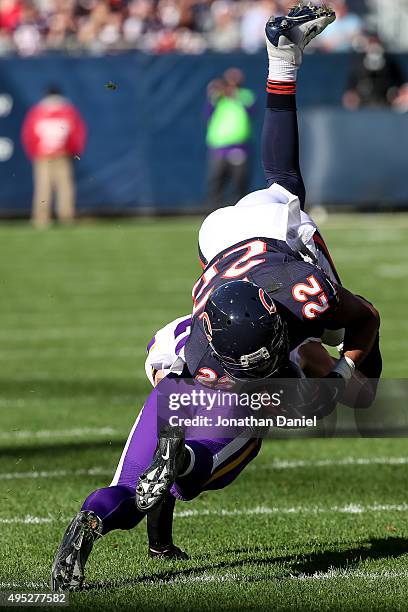 Matt Forte of the Chicago Bears is hit by Harrison Smith of the Minnesota Vikings, resulting in Forte having a leg injury and leaving the game, in...