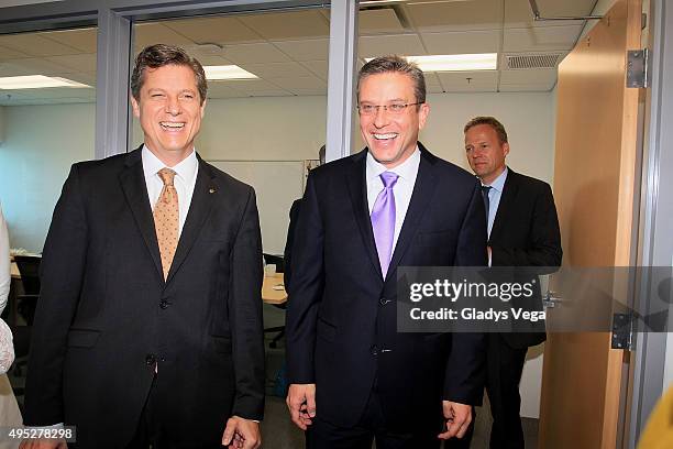 Elmar Lutter, CEO of LTPR and Governor of Puerto Rico Alejandro Garcia Padilla attend the opening of Lufthansa Technik Puerto Rico on November 1,...