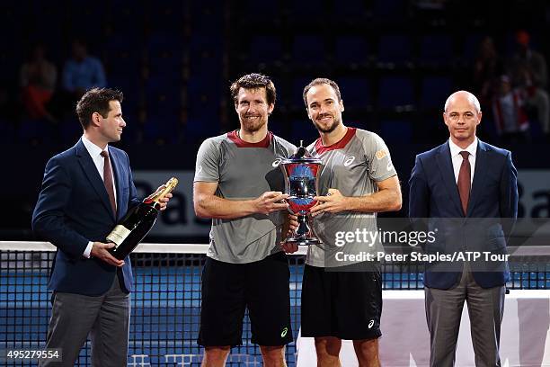 Doubles Champions Alexander Peya of Austria and Bruno Soares of Brazil with the trophy and champagne at the Swiss Indoors Basel at St. Jakobshalle on...