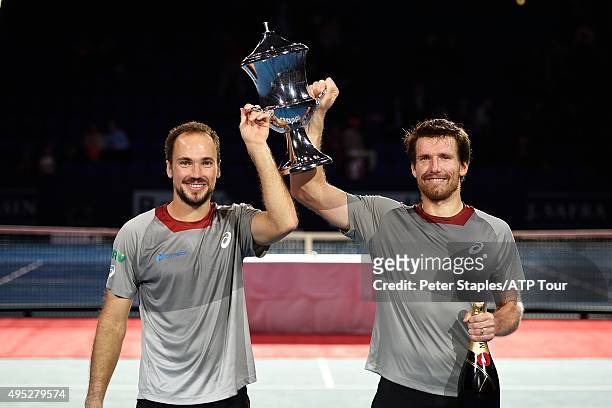 Doubles Champions Alexander Peya of Austria and Bruno Soares of Brazil with the trophy and champagne at the Swiss Indoors Basel at St. Jakobshalle on...