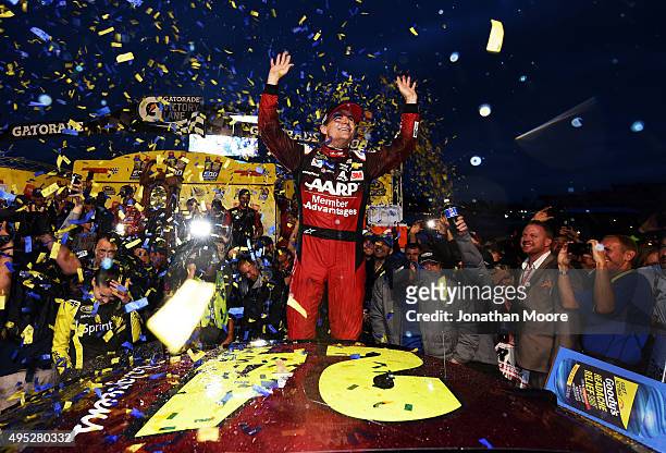 Jeff Gordon, driver of the AARP Member Advantages Chevrolet, celebrates in Victory Lane after winning the NASCAR Sprint Cup Series Goody's Headache...