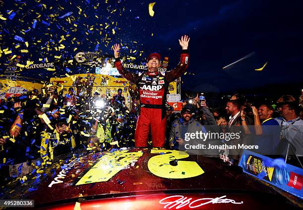 Jeff Gordon, driver of the AARP Member Advantages Chevrolet, celebrates in Victory Lane after winning the NASCAR Sprint Cup Series Goody's Headache...