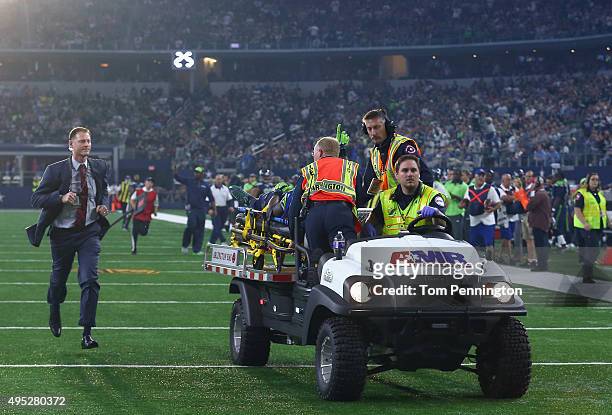 Ricardo Lockette of the Seattle Seahawks waves to fans while being carted off the field in the second quarter at AT&T Stadium on November 1, 2015 in...