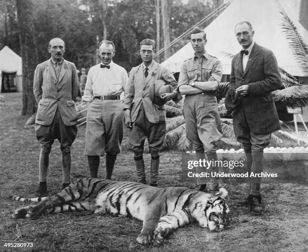 The Prince of Wales and his prize tiger that he shot on his hunting expedition into the Himalayas, Nepal, January 29, 1922. From left. Lord Cromer,...