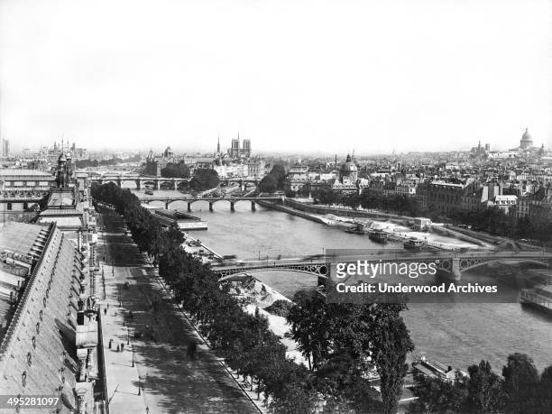Panoramic view of Paris upstream from the Royal Bridge across the River Seine, Paris, France, circa 1890..