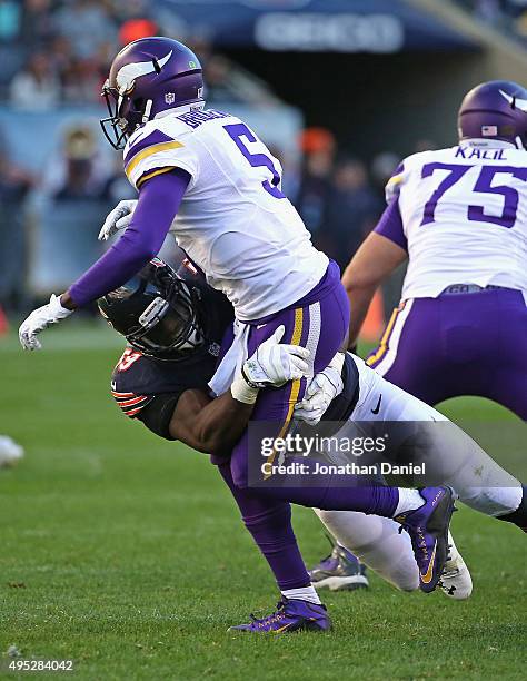 Christian Jones of the Chicago Bears hits Teddy Bridgewater of the Minnesota Vikings at Soldier Field on November 1, 2015 in Chicago, Illinois. The...