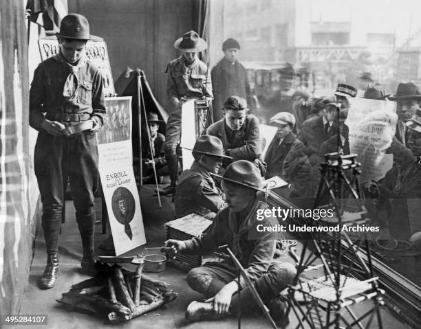 Boy Scouts camped out in the store window of Abercrombie & Fitch as part of their recruitment drive for new scout members, New York, New York,...