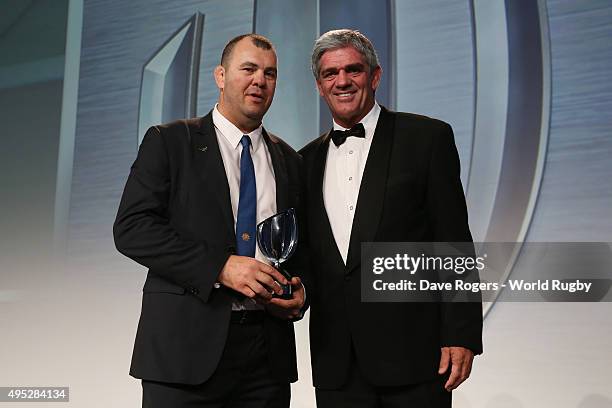 Michael Cheika the coach of Australia receives the World Rugby via Getty Images Coach of the Year award from Mick Mallett during the World Rugby via...