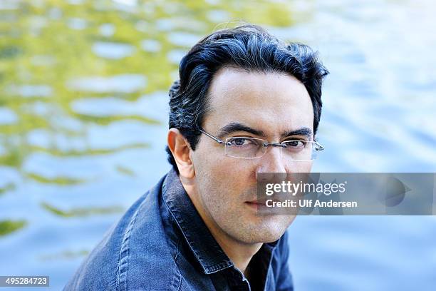 Colombian writer Juan Gabriel Vasquez, poses during a portrait session held on May 18, 2014 in Nantes, France.