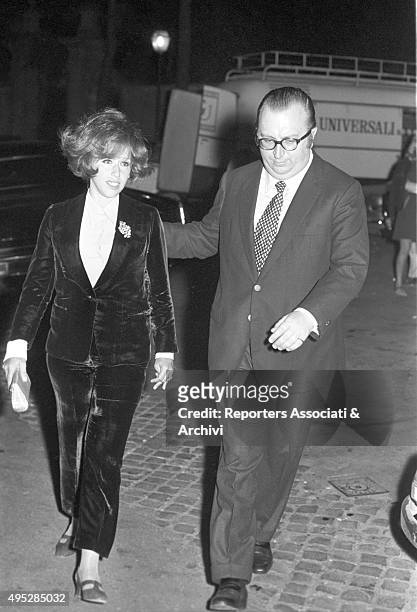 Italian director Sergio Leone and his wife Carla Ranalli walking after the Vides party. Rome, 29th April 1968