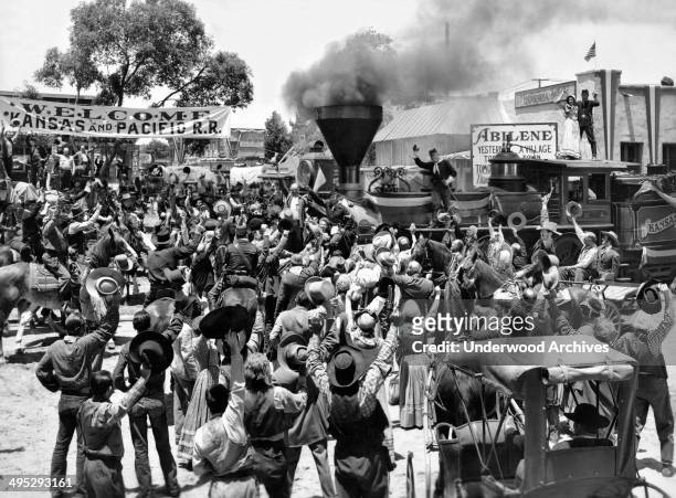 The first steam engine rolls into Abilene, Kansas in 1867 in this scene from the Columbia movie 'Texas,' Hollywood, California, 1941. The engine was...