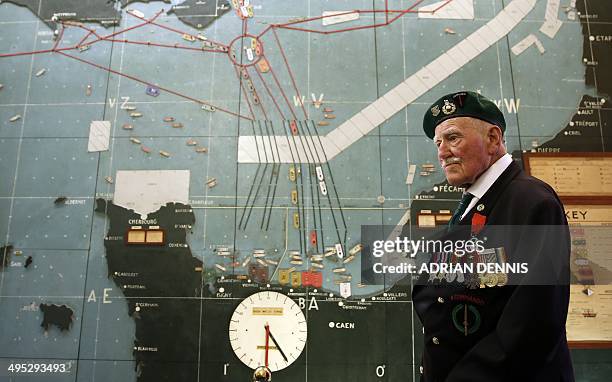 Former Commando Pat Churchill stands in the map room where the D-Day landing beaches are marked at Southwick House near Portsmouth on June 2, 2014....