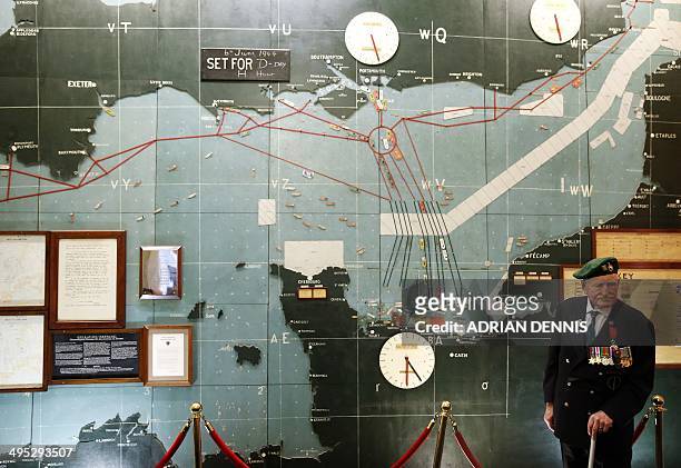 Former Commando Pat Churchill stands in the map room where the D-Day landing beaches are marked at Southwick House near Portsmouth on June 2, 2014....