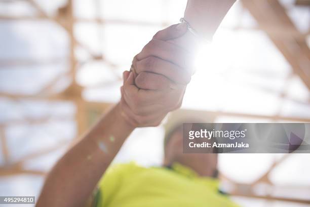 construction worker shaking hands with manager - happy ending bildbanksfoton och bilder