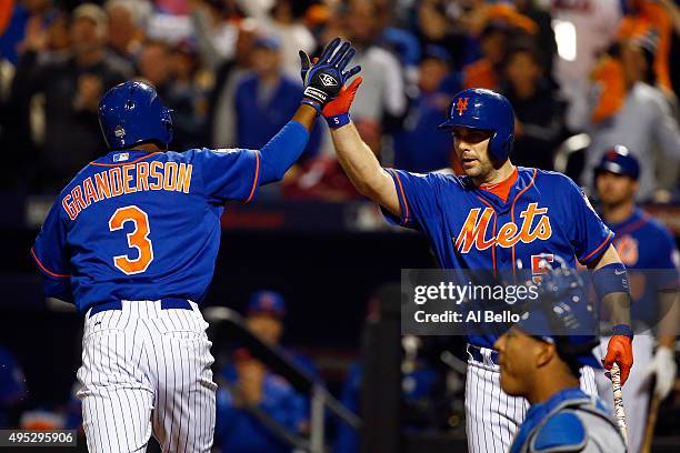 Curtis Granderson of the New York Mets celebrates with David Wright of the New York Mets after hitting a solo home run in the first inning against...