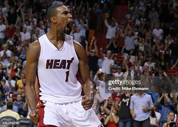 Chris Bosh of the Miami Heat reacts to a play during a game against the Houston Rockets at American Airlines Arena on November 1, 2015 in Miami,...