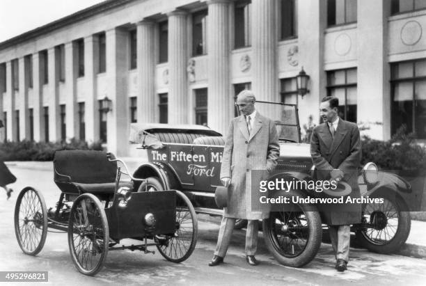 Henry Ford and Edsel Ford with the original 1896 Quadricycle and the 15th millionth Ford Model T, Detroit, Michigan, 1927.