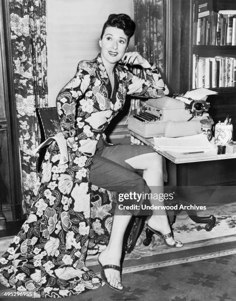 Burlesque entertainer and actress Gypsy Rose Lee at work on her memoir, 1956.