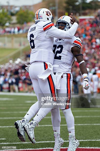 Jeremy Johnson and Melvin Ray of the Auburn Tigers celebrate after a touchdown against the Arkansas Razorbacks at Razorback Stadium Stadium on...