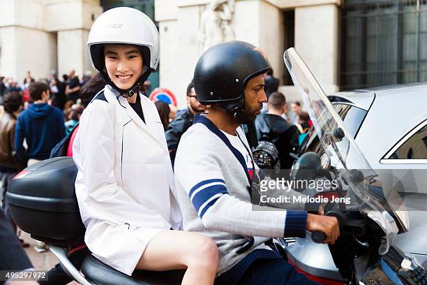 Chinese model Dylan Xue exits the Salvatore Ferragamo show by motorbike during the Milan Fashion Week Spring/Summer 16 on September 27, 2015 in...