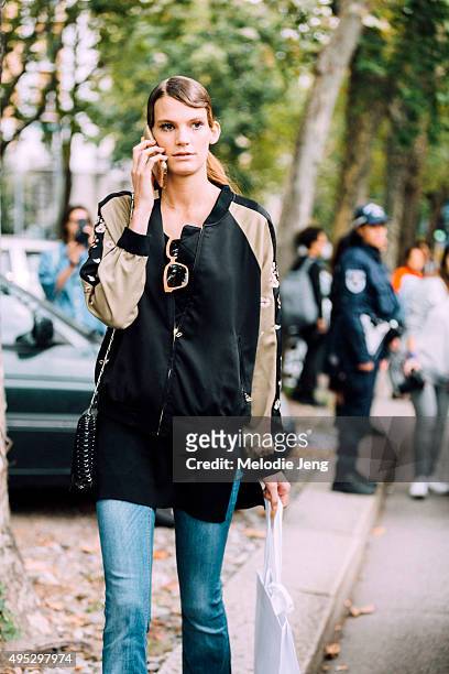 German model Lena Hardt exits the Marni show during the Milan Fashion Week Spring/Summer 16 on September 27, 2015 in Milan, Italy. Lena checks her...