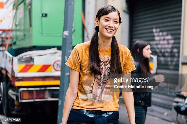 Tiana Tolstoi exits the Marni show during the Milan Fashion Week Spring/Summer 16 on September 27, 2015 in Milan, Italy. Tiana wears orange Tiger...