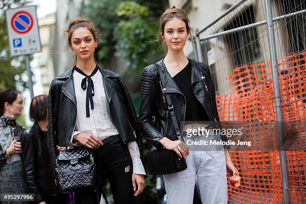 Russian models Zhenya Katava and Irina Shnitman exit the Dolce & Gabbana show at Metropol during the Milan Fashion Week Spring/Summer 16 on September...