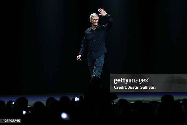 Apple CEO Tim Cook arrives to speak during the Apple Worldwide Developers Conference at the Moscone West center on June 2, 2014 in San Francisco,...