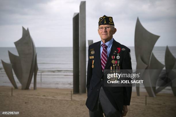 Veteran Edward W.Oleksak, who landed on June 6, 1944 in Omaha Beach, poses in front of the statue ''Les Braves'' by French sculptor Anilore Banon, on...