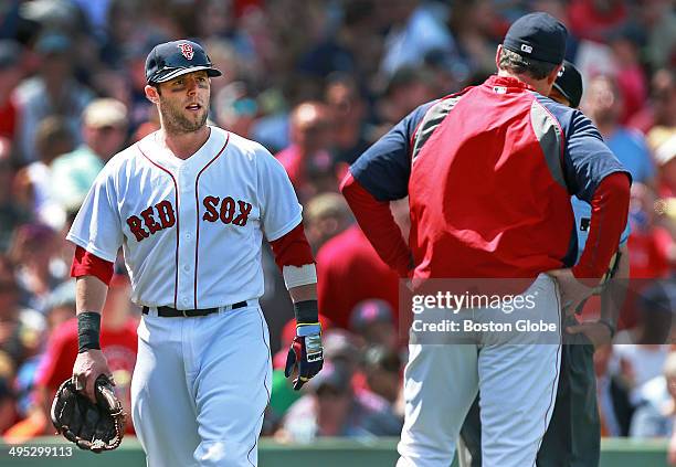 The Red Sox Dustin Pedroia, left, heads for the clubhouse after home plate umpire D. J. Reyburn ejected him from the game after the third inning. Red...