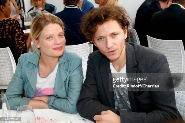 Actress Melanie Thierry and her companion singer Raphael attend the Roland Garros French Tennis Open 2014 - Day 9 on June 2, 2014 in Paris, France.