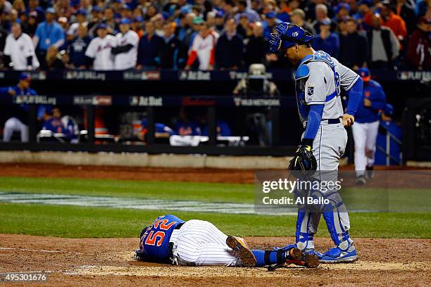 Yoenis Cespedes of the New York Mets lies on the ground after fouling the ball off of his leg in the sixth inning against the Kansas City Royals...
