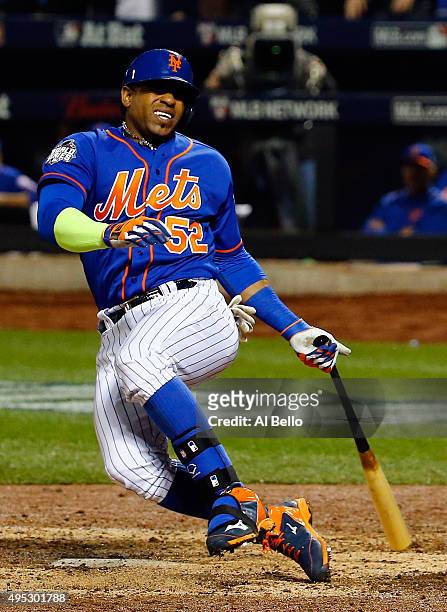 Yoenis Cespedes of the New York Mets reacts as he fouls the ball off of his leg in the sixth inning against the Kansas City Royals during Game Five...