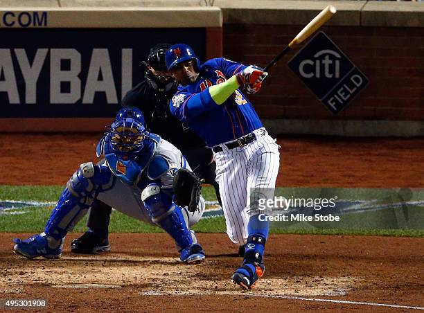Yoenis Cespedes of the New York Mets fouls the ball off of his leg in the sixth inning against the Kansas City Royals during Game Five of the 2015...