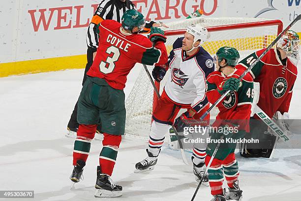 Charlie Coyle of the Minnesota Wild and David Clarkson of the Columbus Blue Jackets shove each other after the whistle during the game on October 22,...