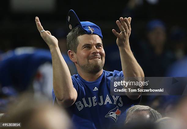 Toronto Blue Jays fan cheers on his team while wearing a rally cap against the Kansas City Royals during game four of the American League...