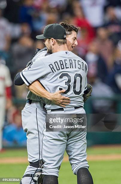 Closing pitcher David Robertson celebrates with catcher Rob Brantly of the Chicago White Sox after winning the game against the Cleveland Indians at...