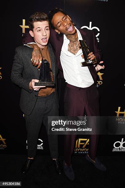 Singer Charlie Puth and rapper Wiz Khalifa, winners of the Hollywood Song Award for "See You Again," pose in the press room during the 19th Annual...