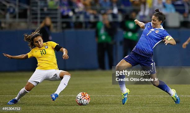 Shannon Boxx of the United States battles Marta of Brazil at CenturyLink Field on October 21, 2015 in Seattle, Washington. Boxx retired from the...