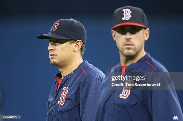 Allen Craig of the Boston Red Sox and Travis Shaw look on during batting practice before MLB game action against the Toronto Blue Jays on September...