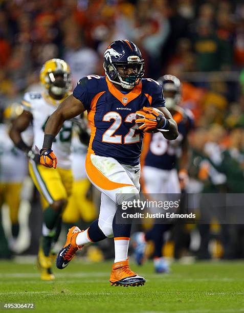 Anderson of the Denver Broncos runs the ball for a third quarter touchdown against the Green Bay Packers at Sports Authority Field at Mile High on...