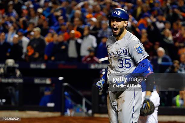 Eric Hosmer of the Kansas City Royals celebrates after scoring a run off of a grounded out hit by Salvador Perez to tie the game in the ninth inning...