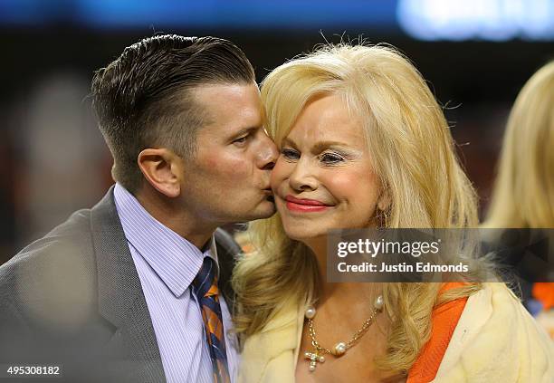 Annabel Bowlen, wife of Denver Broncos owner Pat Bowlen, is kissed by their son John as the two celebrate Pat Bowlen's induction as the 28th member...