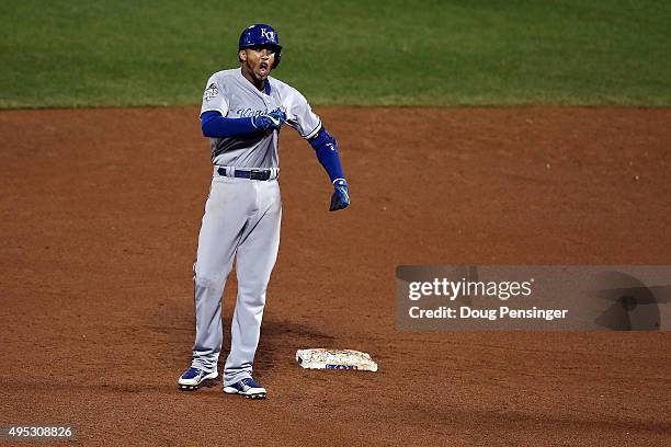Alcides Escobar of the Kansas City Royals celebrates on second base after hitting a double to left field to score Christian Colon in the twelfth...