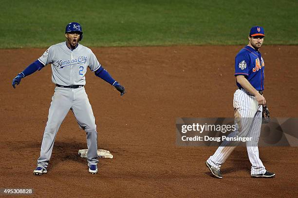 Alcides Escobar of the Kansas City Royals celebrates on second base after hitting a double to left field to score Christian Colon in the twelfth...
