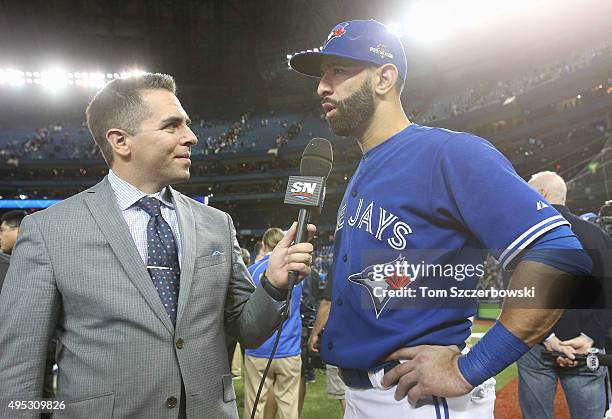 Jose Bautista of the Toronto Blue Jays is interviewed by Sportsnet's Barry Davis after their victory against the Kansas City Royals during game five...