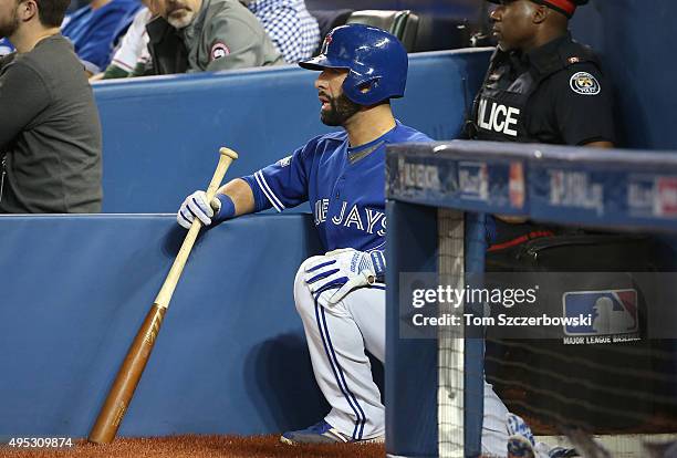 Jose Bautista of the Toronto Blue Jays gets ready to bat as he looks on from the top step of the dugout against the Kansas City Royals during game...