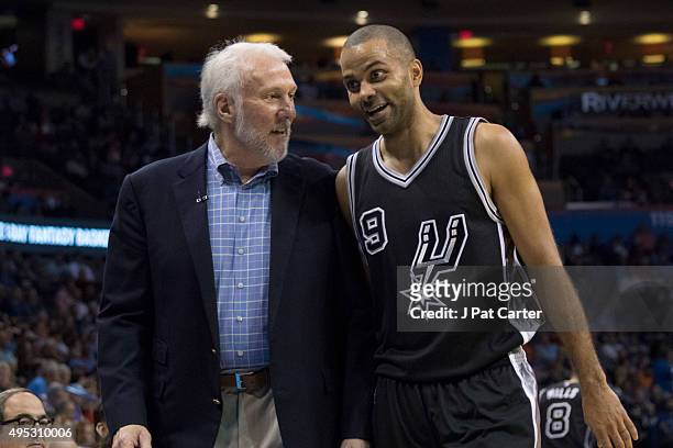 Coach Gregg Popovich talks to Tony Parker of the San Antonio Spurs during the fourth quarter of a NBA game against the Oklahoma City Thunder at the...