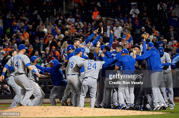 Members of the Kansas City Royals celebrate on the field after defeating the New York Mets in Game 5 of the 2015 World Series at Citi Field on...