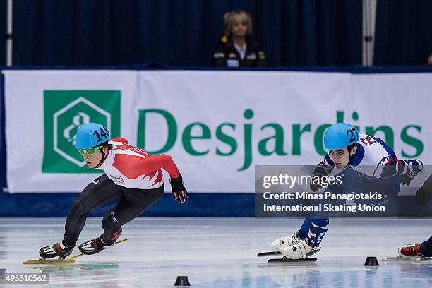 Charle Cournoyer of Canada competes against Dmitry Migunov of Russia on Day 2 of the ISU World Cup Short Track Speed Skating competition at...